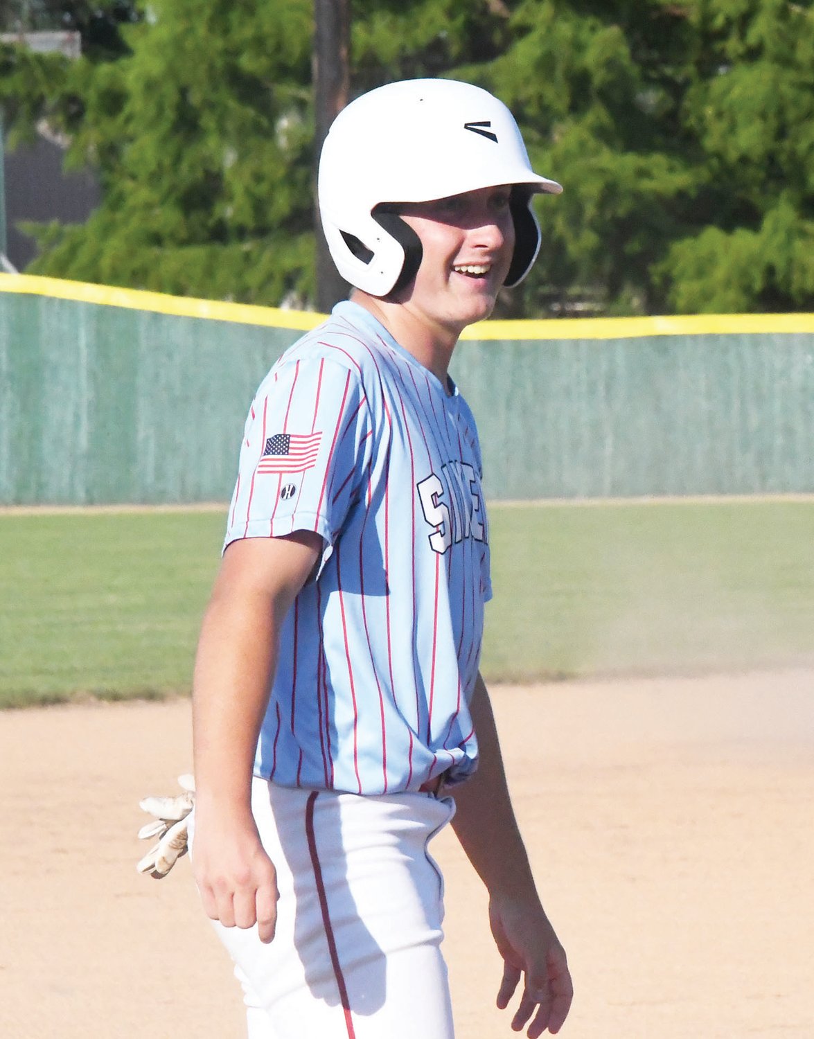 Moberly's Carson Fletcher smiles after reaching third base during last Thursday's game.