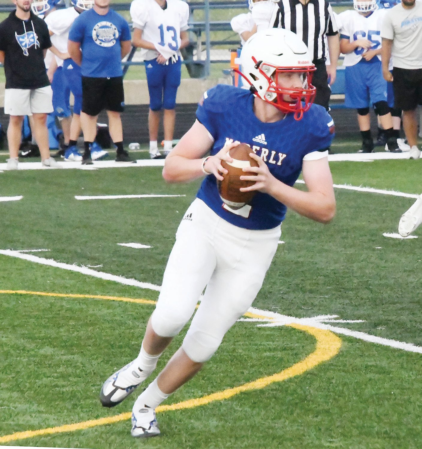 Moberly quarterback Jackson Engel rolls out to pass during the scrimmage.