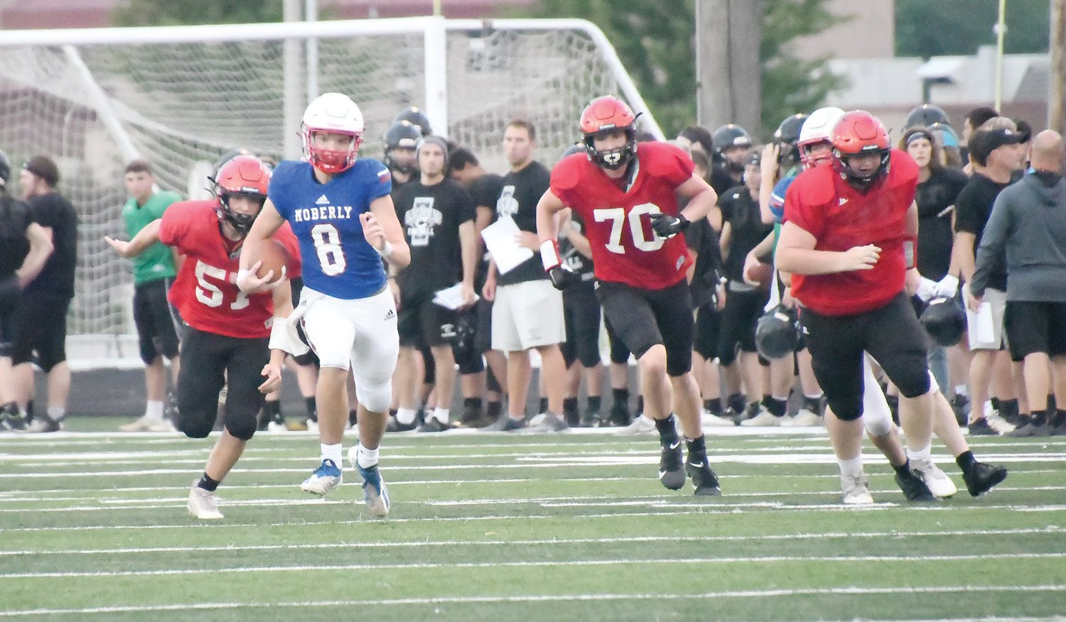 Collin Huffman breaks into the clear, scrambling for extra yards during the scrimmage versus Southern Boone.