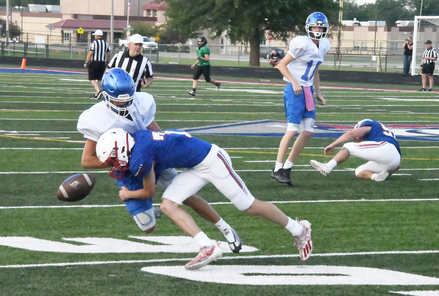Moberly's Caden Hansen jars the ball loose, forcing a Boonville incomplete pass.