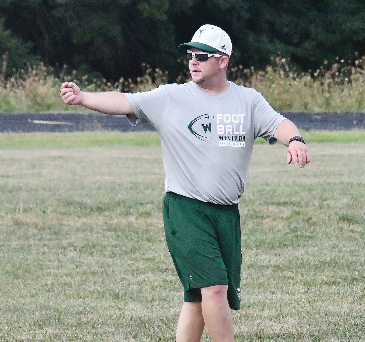Westran High School head football coach and athletic director Aaron O'Laughlin motions during the first official practice of the season on Monday, Aug. 8.