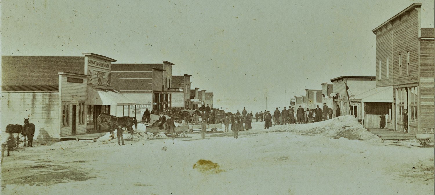 In this undated photo, people mingle on a snow-covered Higbee street. The town will celebrate 150 years during its annual fair next week.