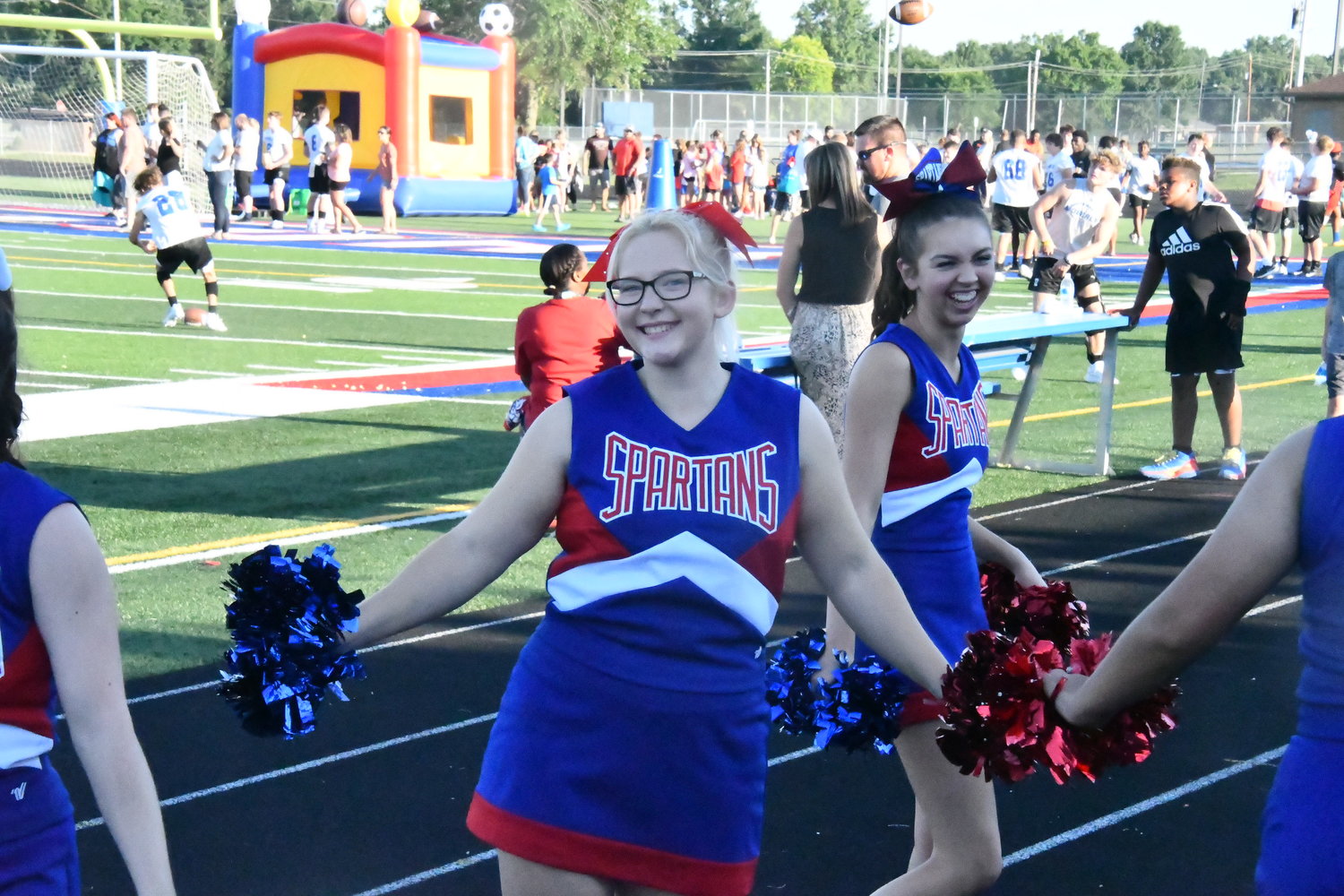 Moberly High School cheerleader Kloiee Wagner, a sophomore, smiles while invigorating fans through a routine during ‘Meet The Spartans’ Night.