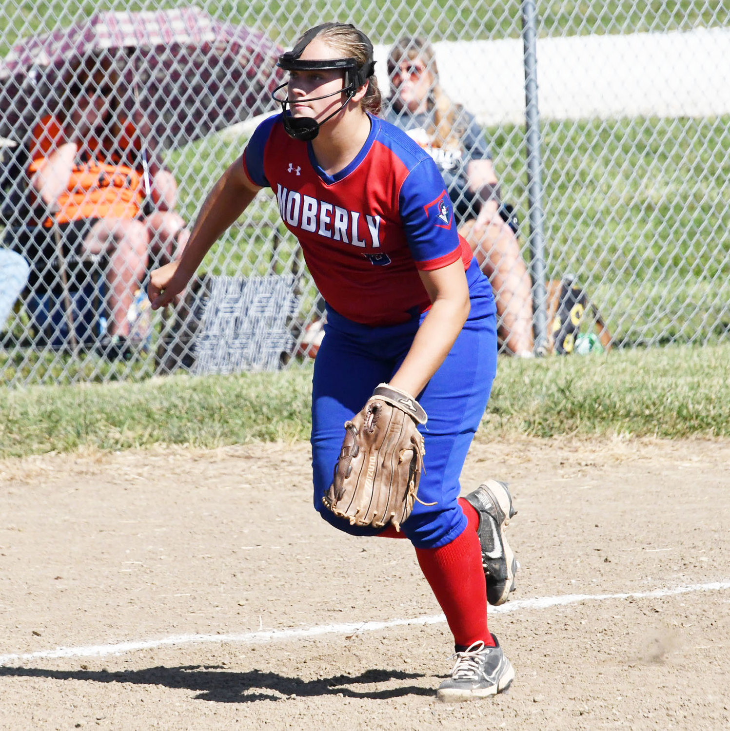 Moberly third baseman Jordan Pasbrig charges toward home plate for a possible Macon bunt during the second inning.