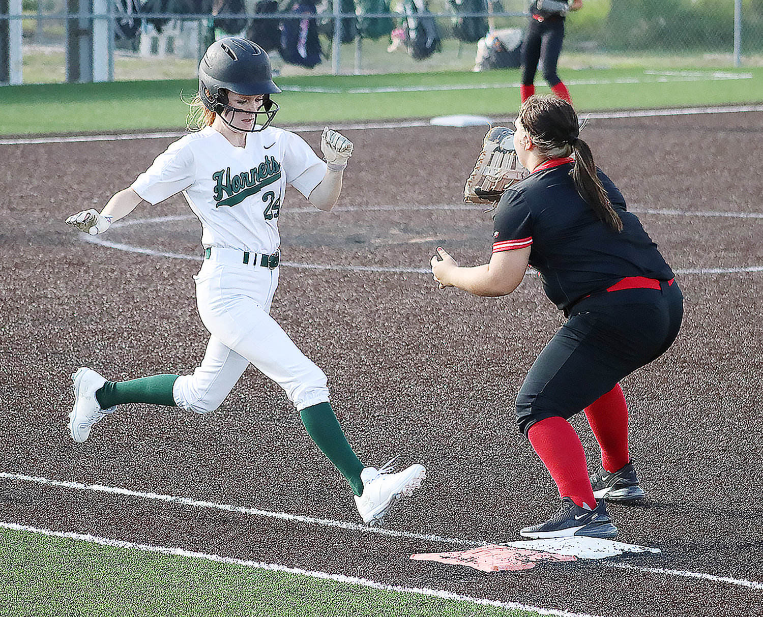 Westran's Lauren Harlan beats Knox County's defense to the bag for an infield single during the jamboree in Shelbina.