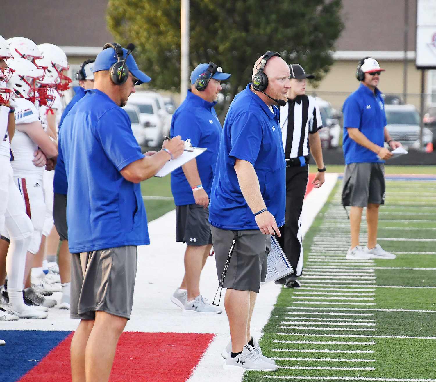 Moberly defensive coordinator Brett Boyer makes a call during the jamboree contest versus Boonville.