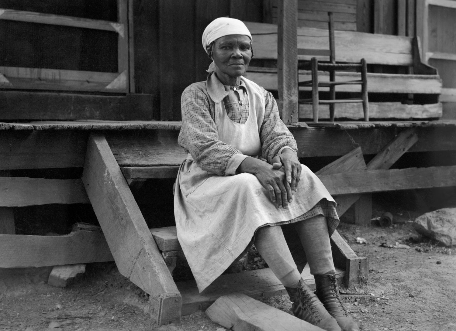 This photo of a woman sitting on porch steps is part of an exhibit at the Center for Missouri Studies in Columbia. Photograph by O.N. Pruitt.