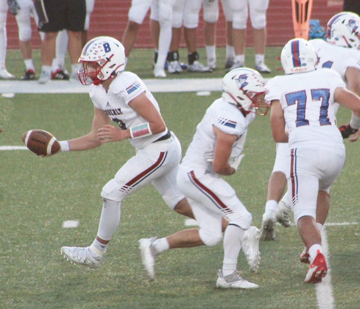 Moberly High School quarterback Collin Huffman (8) executes a fake hand-off during last Friday’s game on the road at Winfield. Huffman produced more than 100 rushing yards, and he passed for 150 more in a 39-21 victory, the Spartans second straight.