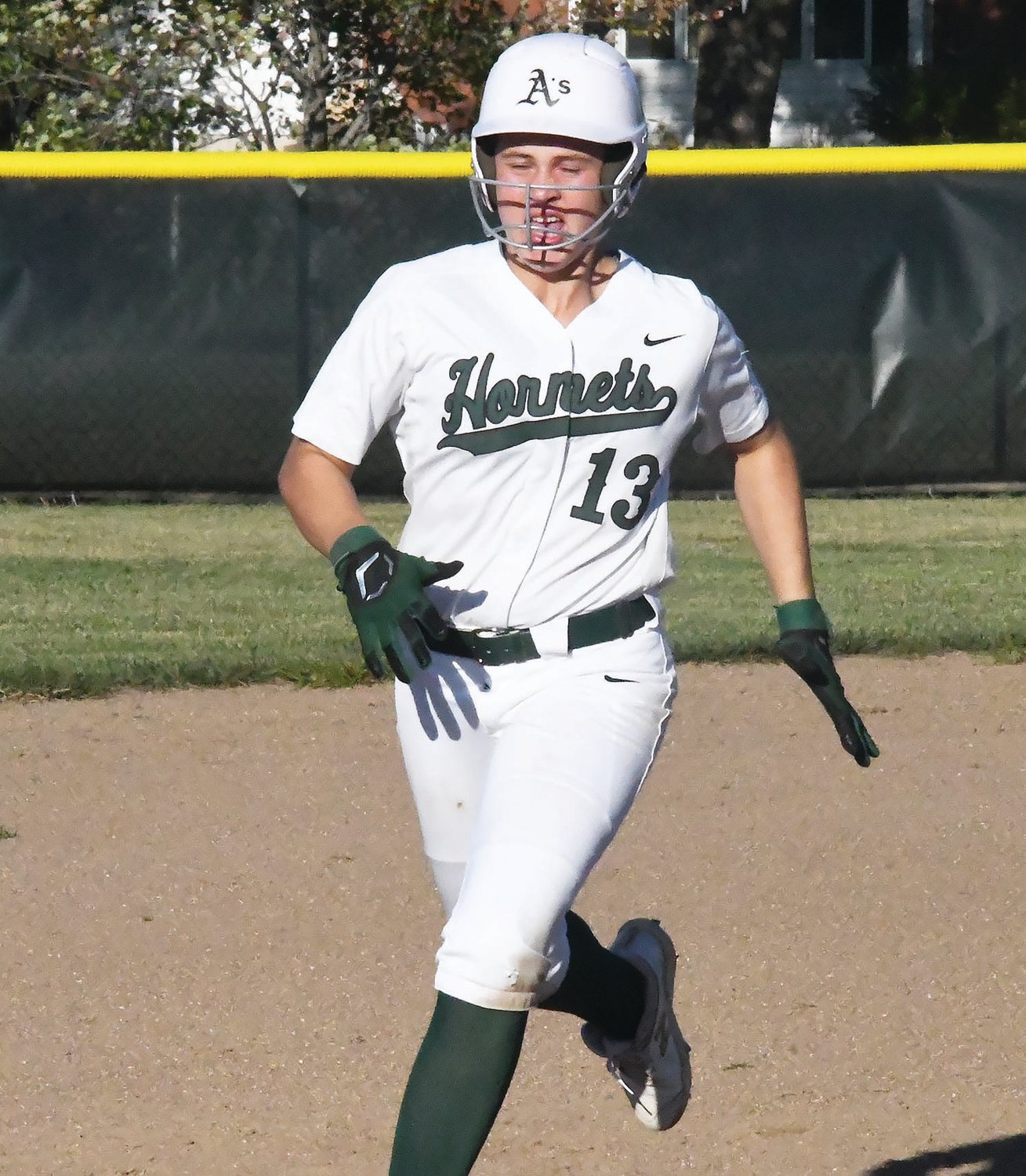 Westran High School’s Kate Hollman (13) runs toward third base during Monday’s home game versus Sturgeon at Huntsville. Hollman scored three runs and she tripled in this 15-0 non-league romp.