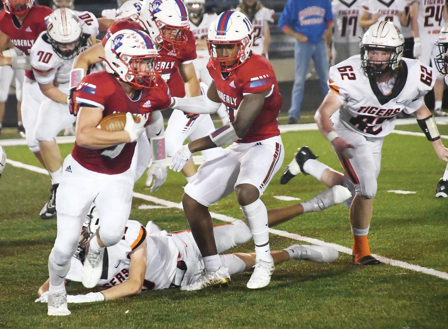 Moberly's Gage St. Clair tries to escape a Kirksville tackle during Friday's North Central Missouri Conference football game. The Tigers topped the Spartans, 34-14.