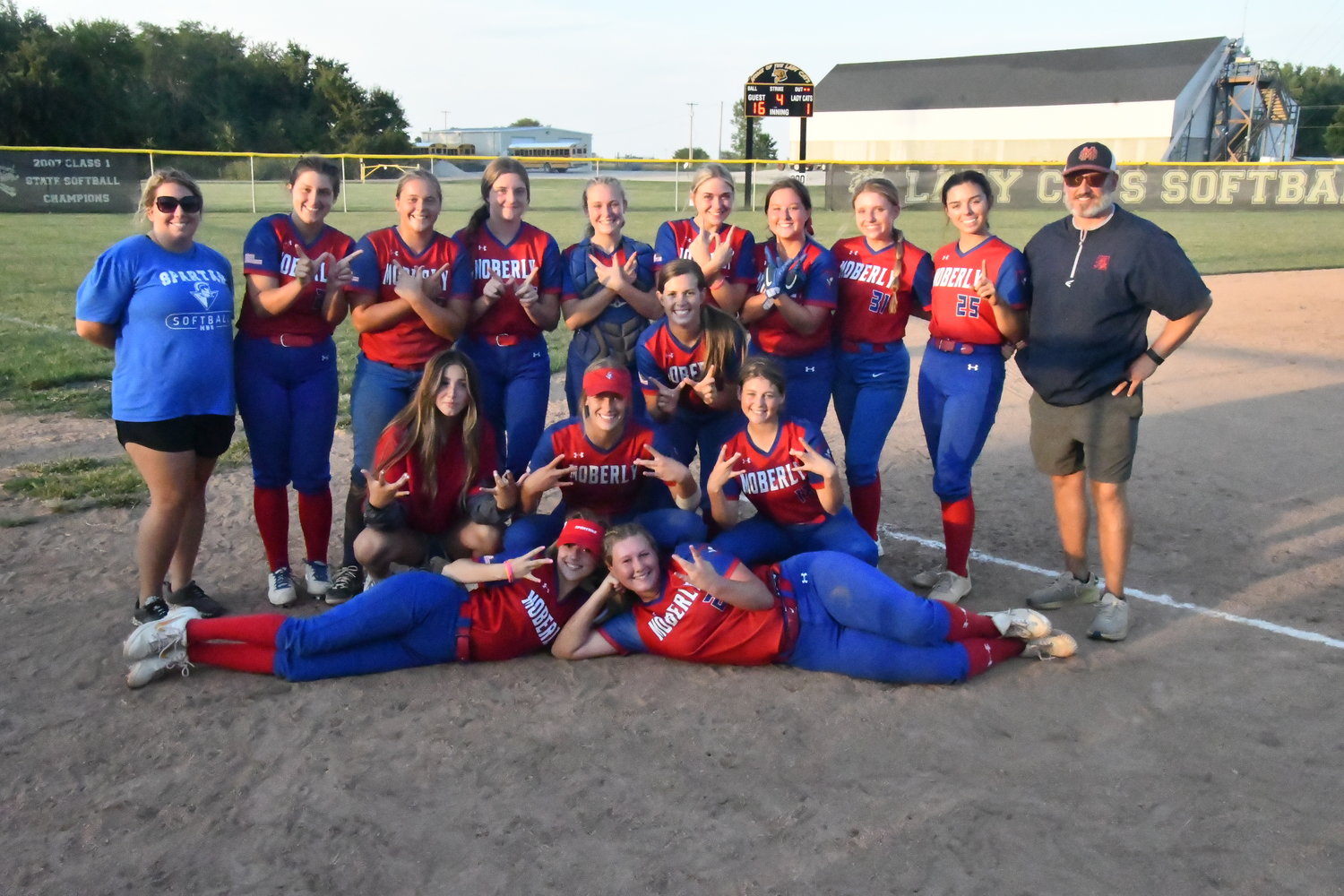 The Moberly High School softball team gathered for a group photo after Saturday's championship victory over Cairo.