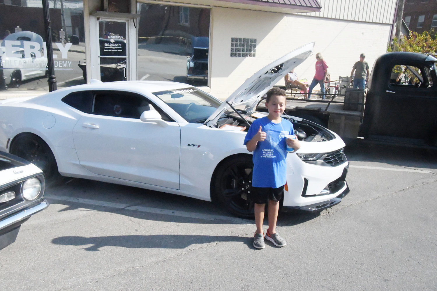 This young fan enjoyed the car show, especially looking at this 2022 Chevrolet Camaro LTI owned by Greg Carlos.