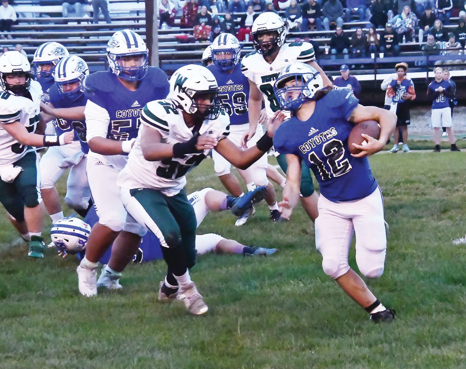 Westran linebacker Blake Williams (52) pursues Paris running back Drew Williams (12) during Friday’s Lewis & Clark Conference game at Warbritton Field in Paris. The Hornets pulled away late, securing a 46-8 victory, their second of the season.