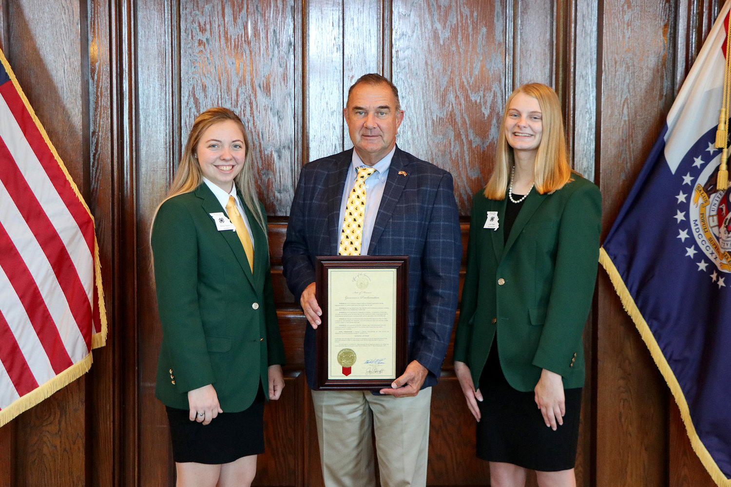 Missouri 4-H State Council President Emily Taylor, left, Missouri Lt. Gov. Mike Kehoe and 4-H State Council Vice President Lynn Dyer with the proclamation making Oct. 2-8 National 4-H week.