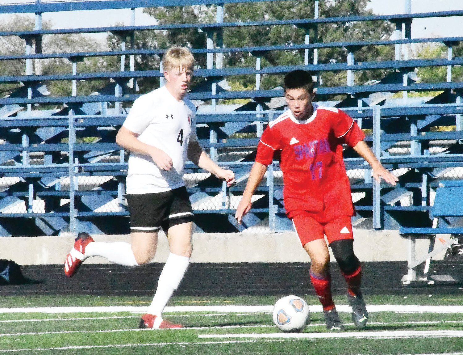 Moberly High School sophomore Ryan O'Loughlin dribbles the ball during a Moberly Tournament match on Saturday, Sept. 24. The Spartans are home this evening for a match against Battle (Columbia).