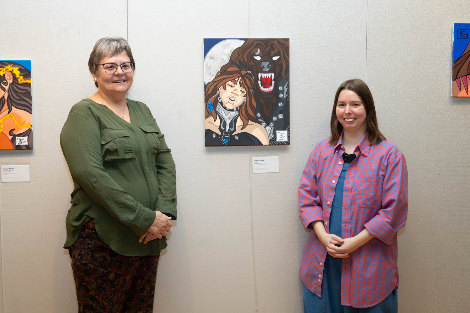 Jane Olgschlagger Jaecques, left, attends the artist’s reception for Megan Brock, a former student, at Jorgenson Fine Arts Gallery in Moberly. Brock credits the teacher with introducing her to werewolves and inspiring her to read and write.
