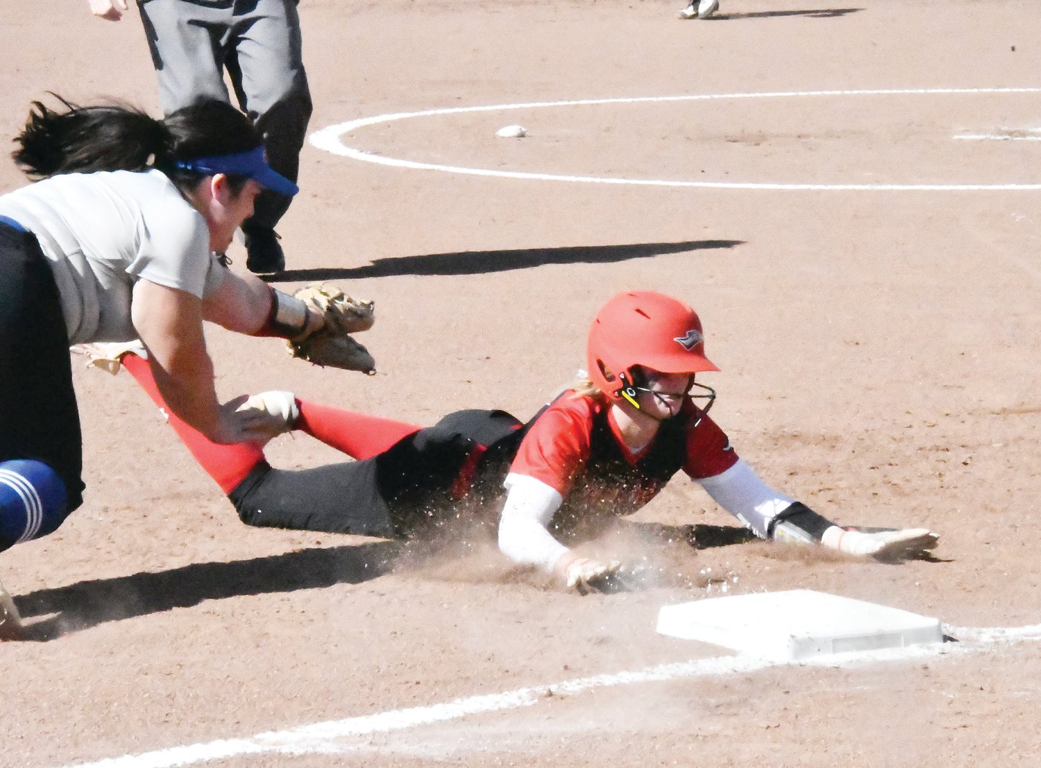 Moberly Area Community College softball player Emma Bruno slides into third base safely. Bruno, who is from Macon, was the first-ever recruit signed to play softball for the Greyhounds.