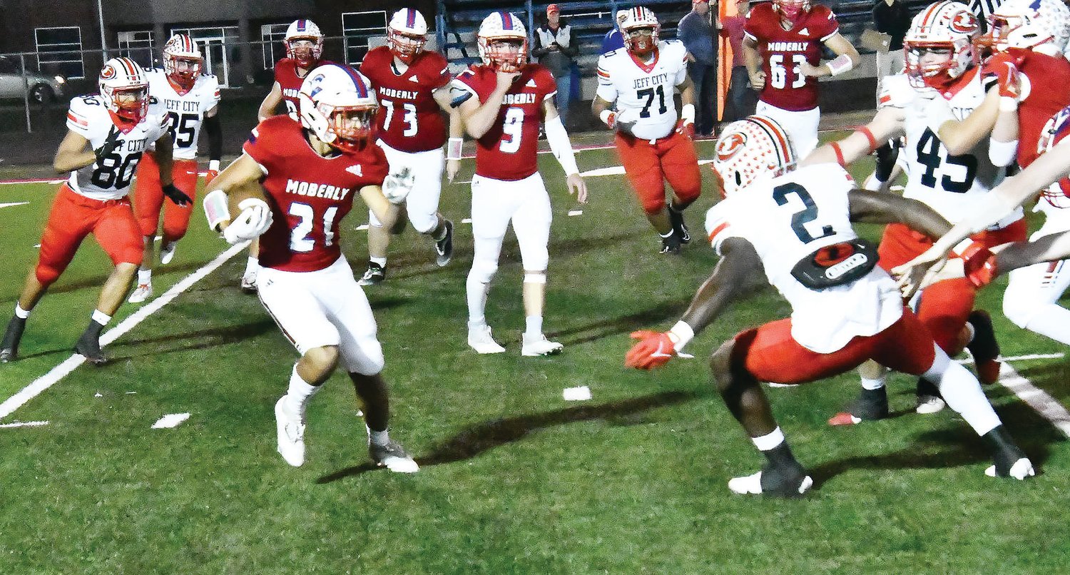 Moberly's K'Von Tiger is pursued by several Jefferson City defenders during Friday's game between the Jays and the Spartans. Jefferson City topped Moberly, 58-14, in the regular-season finale for both teams.