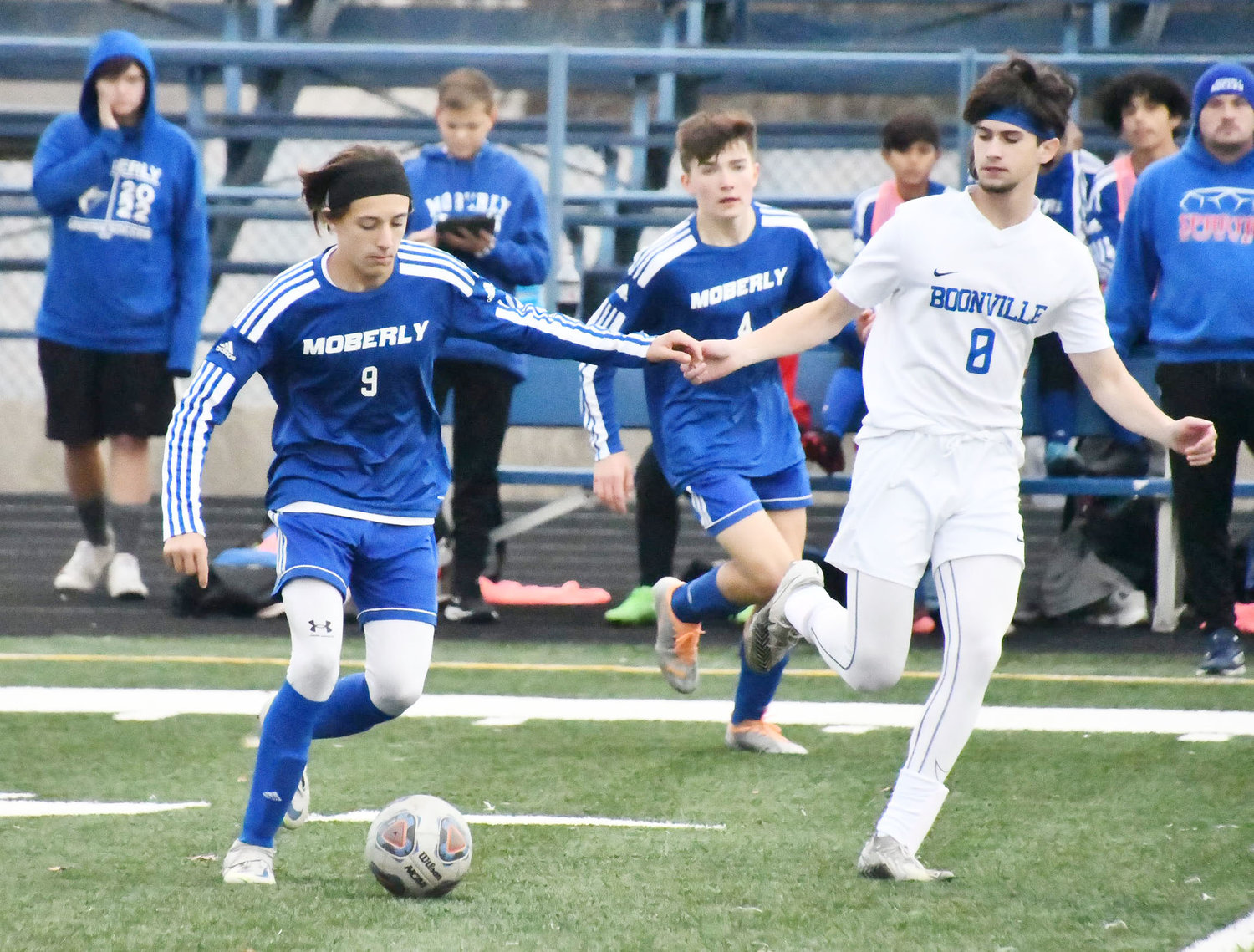 Moberly boys soccer player Lane Longbine dribbles the ball through the midfield during Thursday's game versus Boonville at Dr. Larry K. Noel Spartan Stadium.
