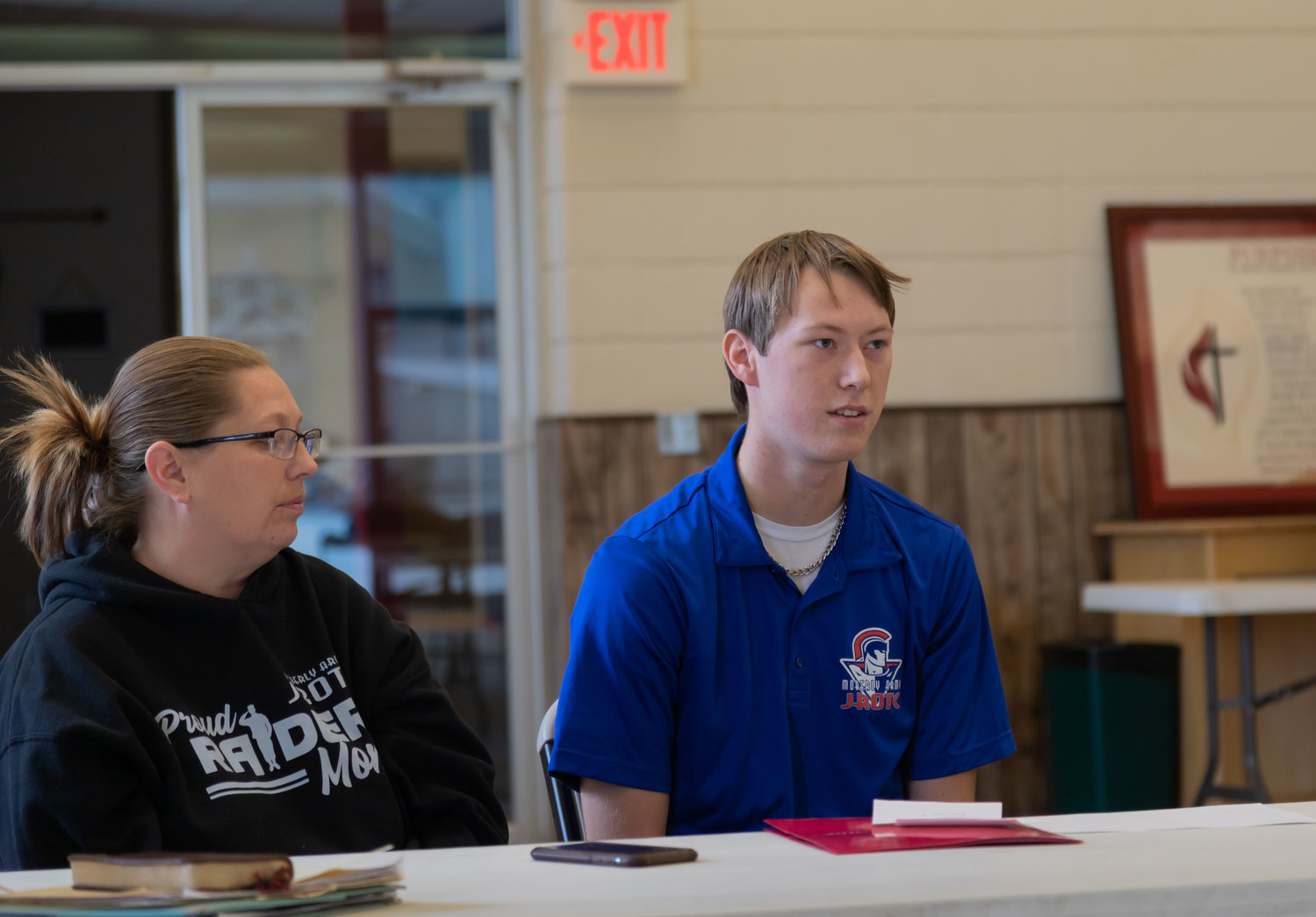 Junior Army Reserve Officer Training Corp Cadet Lester Martin talks to the Randolph County Ministerial Alliance about collecting food and clothing for local families. At left is Martin's mother, Sara, with the JROTC Booster Club.