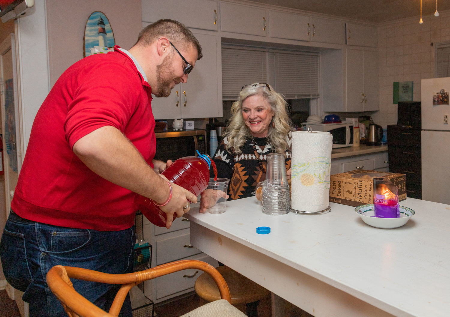 Roger Christy and Ann Elliot prepare refreshments for people in the suicide survivor group that meets monthly at Lighthouse Counseling Center.