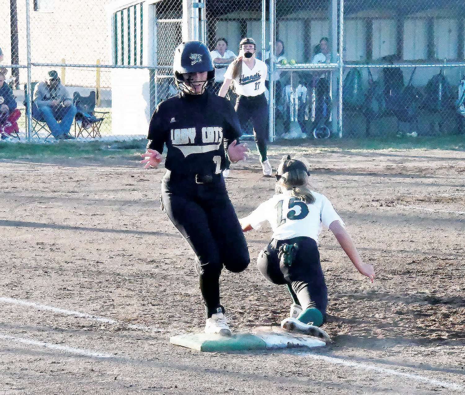 Cairo High School softball player Avery Brumley (black jersey) beats the throw to first base during a Class 1 District 8 semifinal game versus Westran at Kelly Odneal Field in Huntsville. Brumley used her speed to produce an eye-popping on-base percentage this season.