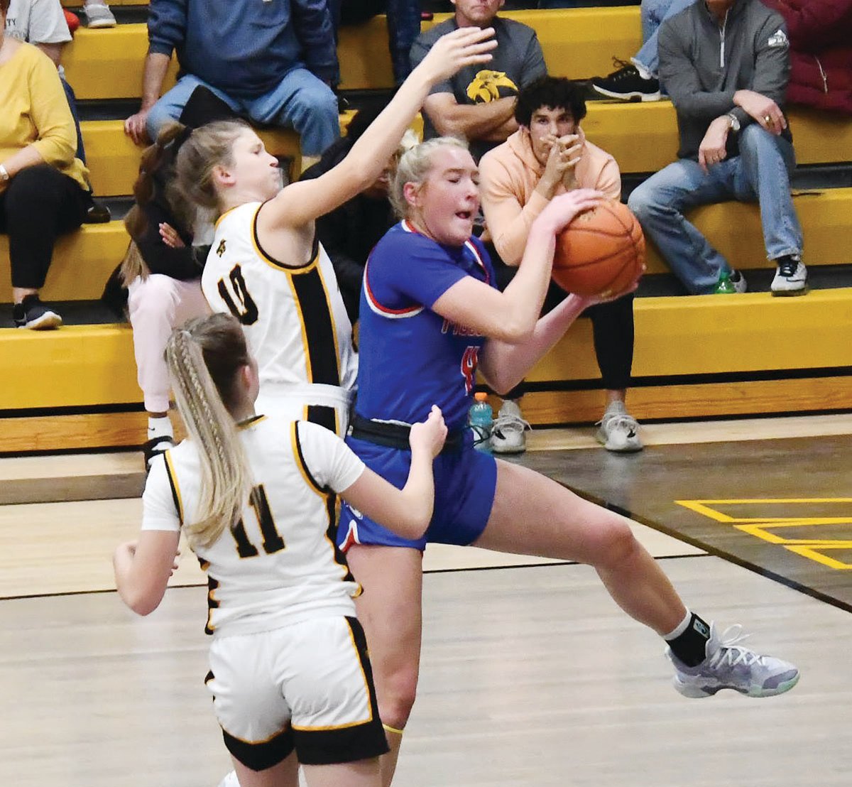 Moberly's Asa Fanning grabs a rebound during Monday's game versus Monroe City.
