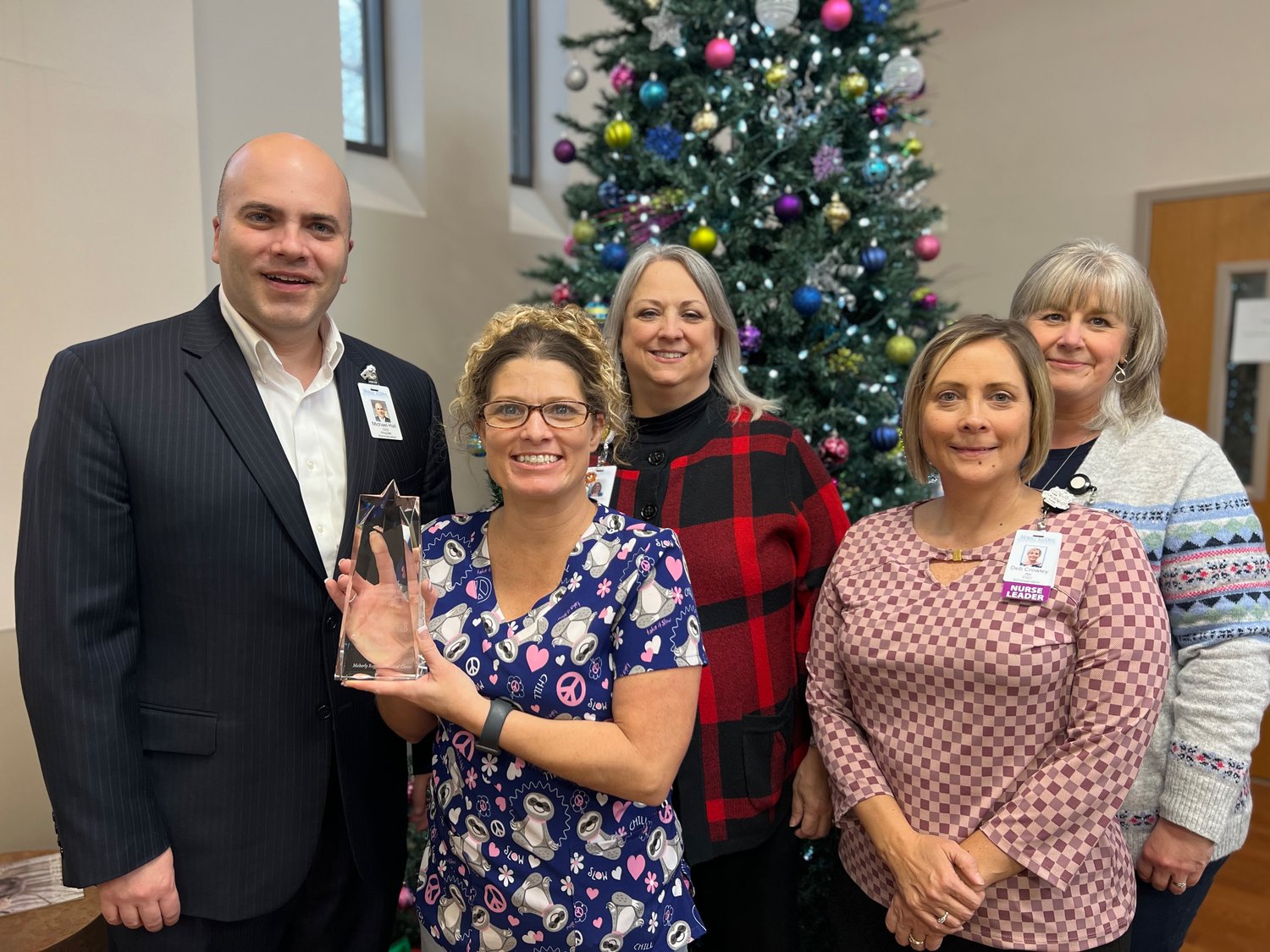 Moberly Regional Medical Center Chief Executive Officer Michael Hall, 2022 Nursing Excellence Award Winner Erica Dollich, Chief Nursing Officer Vicki White, Chief Quality Officer Debbie Crowley and Human Resources Director Karen Crago.