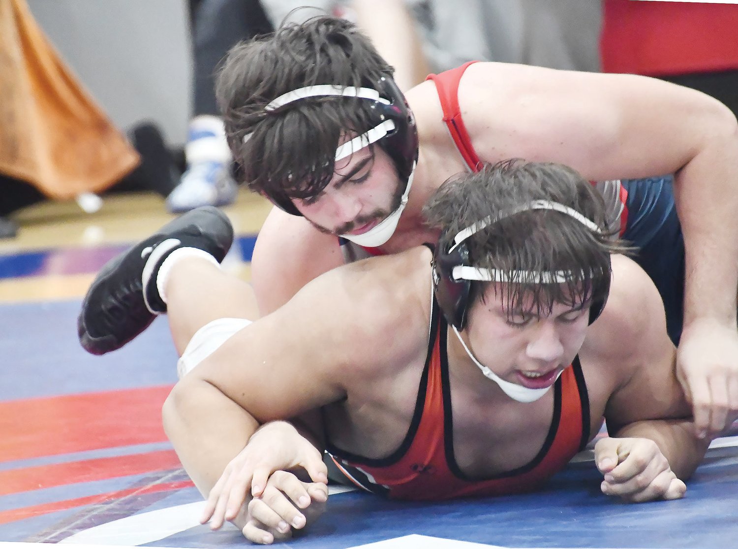 Moberly's Gage Fallaw (top) showed adaptability during a home quadrangular on Tuesday, Jan. 10. Fallaw bumped up to 215 pounds, earning a hard-fought 12-10 decision over state-ranked Jose Suarez from Palmyra. The Spartans swept Palmrya, Boonville and California that evening, running their dual record to 15-7.