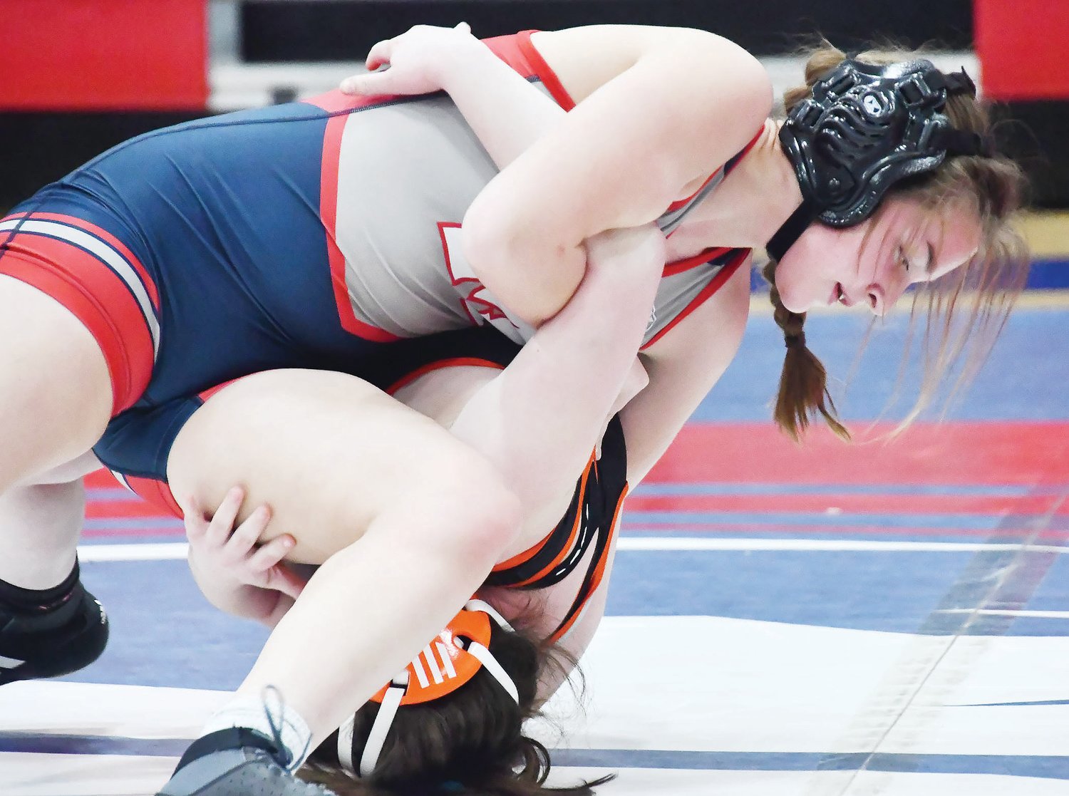 Moberly's Addison Orscheln prepares to pin Summer Gollaher during a quadrangular on Tuesday, Jan. 10. Orscheln would also win the 140-pound weight class at a tournament in Willard last Friday.
