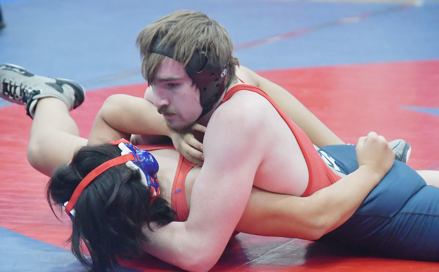 Gannon White prepares for a pin during the a home quadrangular at Moberly High School on Tuesday, Jan. 10.