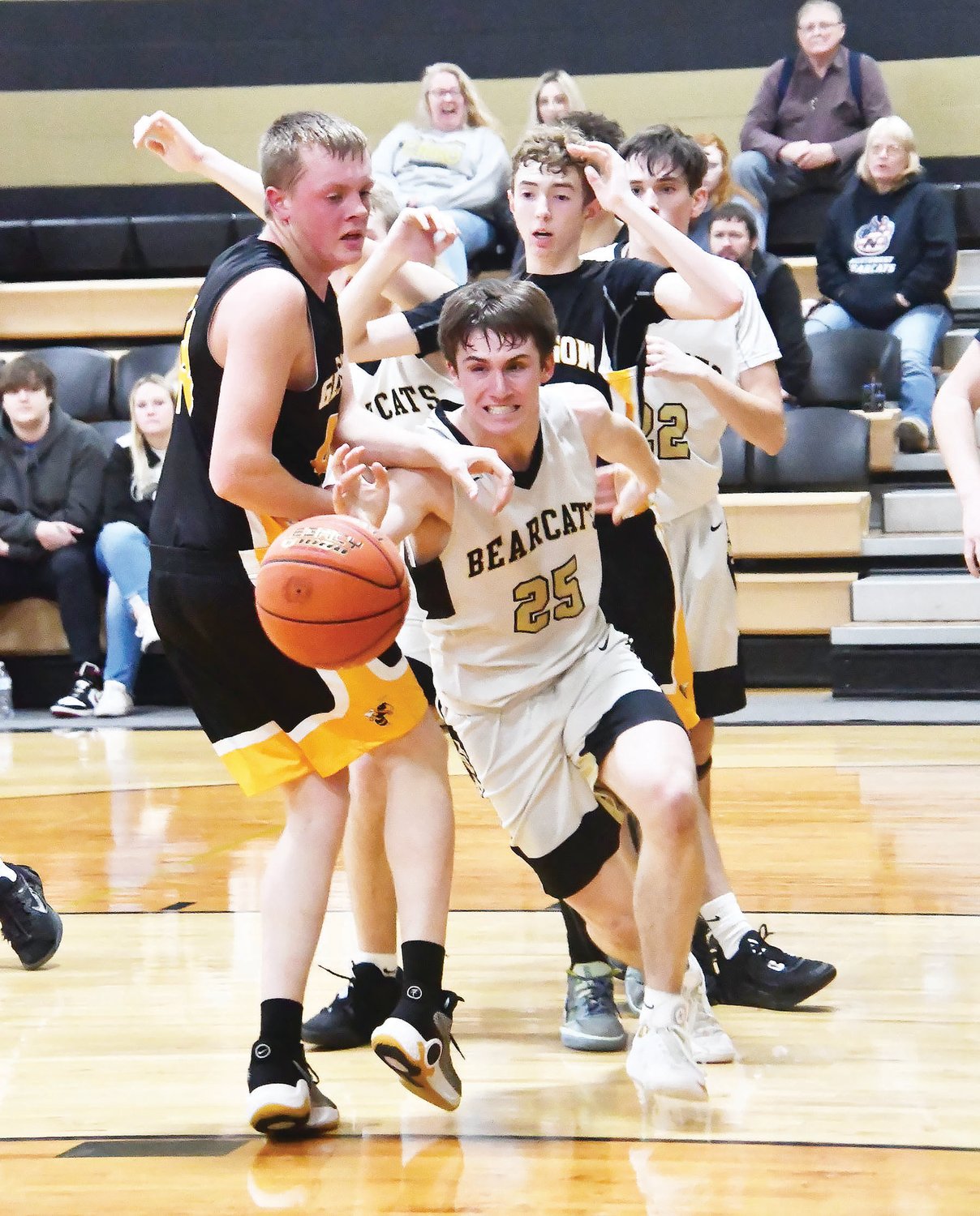 Cairo senior Logan Head (25) chases after the ball while pursued by Glasgow's Preston Thies during a Central Activities Conference boys basketball in Cairo on Thursday, Jan. 12. The Bearcats won, 57-47.