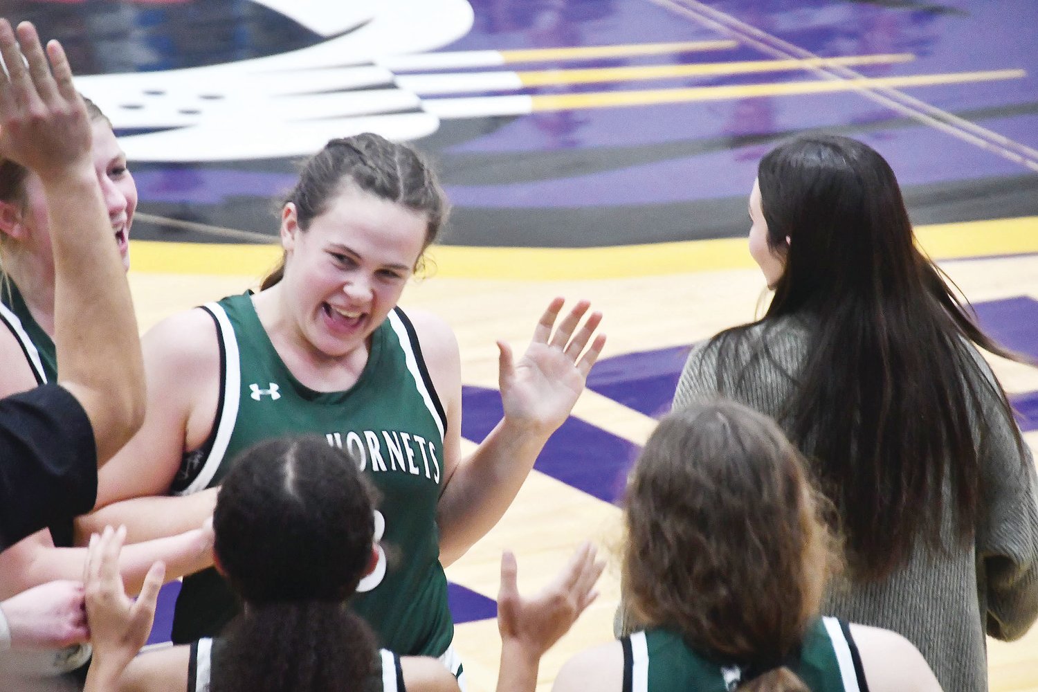 Kate Hollman of Westran reacts after scoring a 3-pointer to close the third quarter.