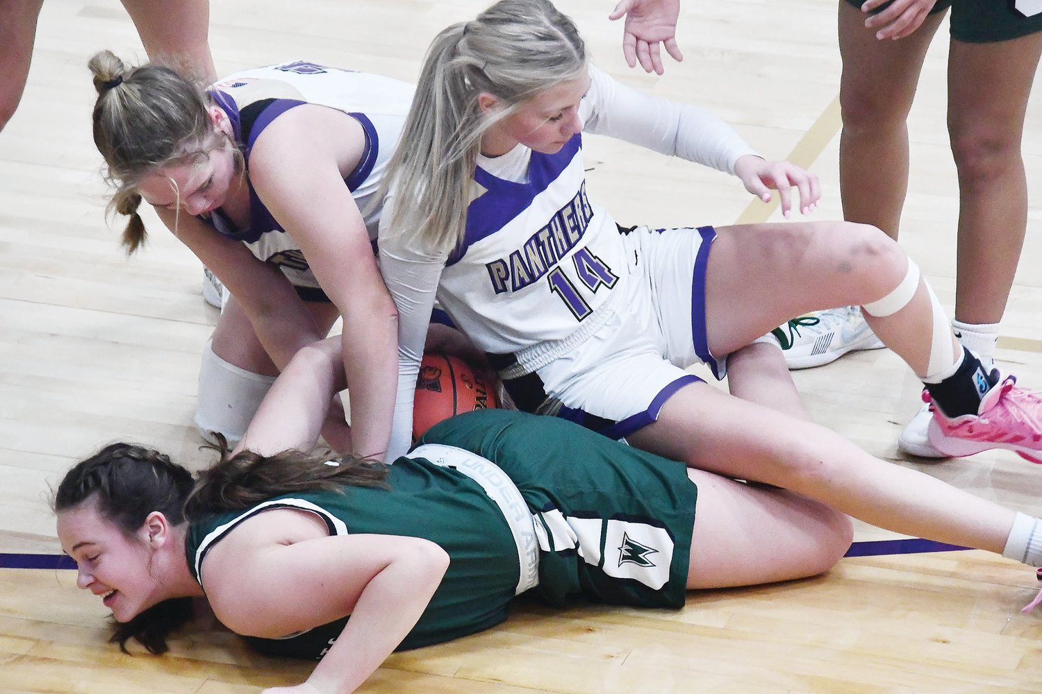 Kate Hollman from Westran reacts after two Salisbury players  (Julia Sloan and Emersyn Hammons) fall on her during a loose ball situation.