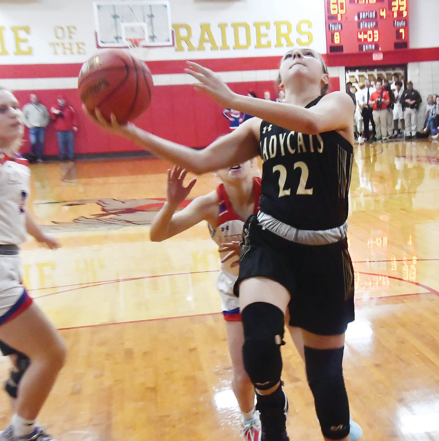 Cairo's Mallori Hankins drives to the basket during the final minute of play, scoring two points.