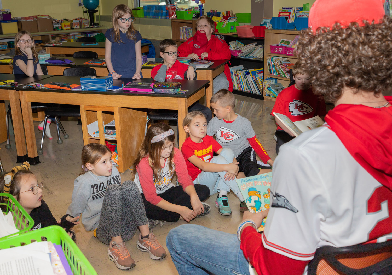 Second graders in Marsha Thornton’s class listen as Jack Prewett reads “Be My Valentine, Amelia Bedelia.” A few minutes earlier, Greyhound pitcher Owen Curley, at right, read “The Berenstain Bears Go Out for the Team.”