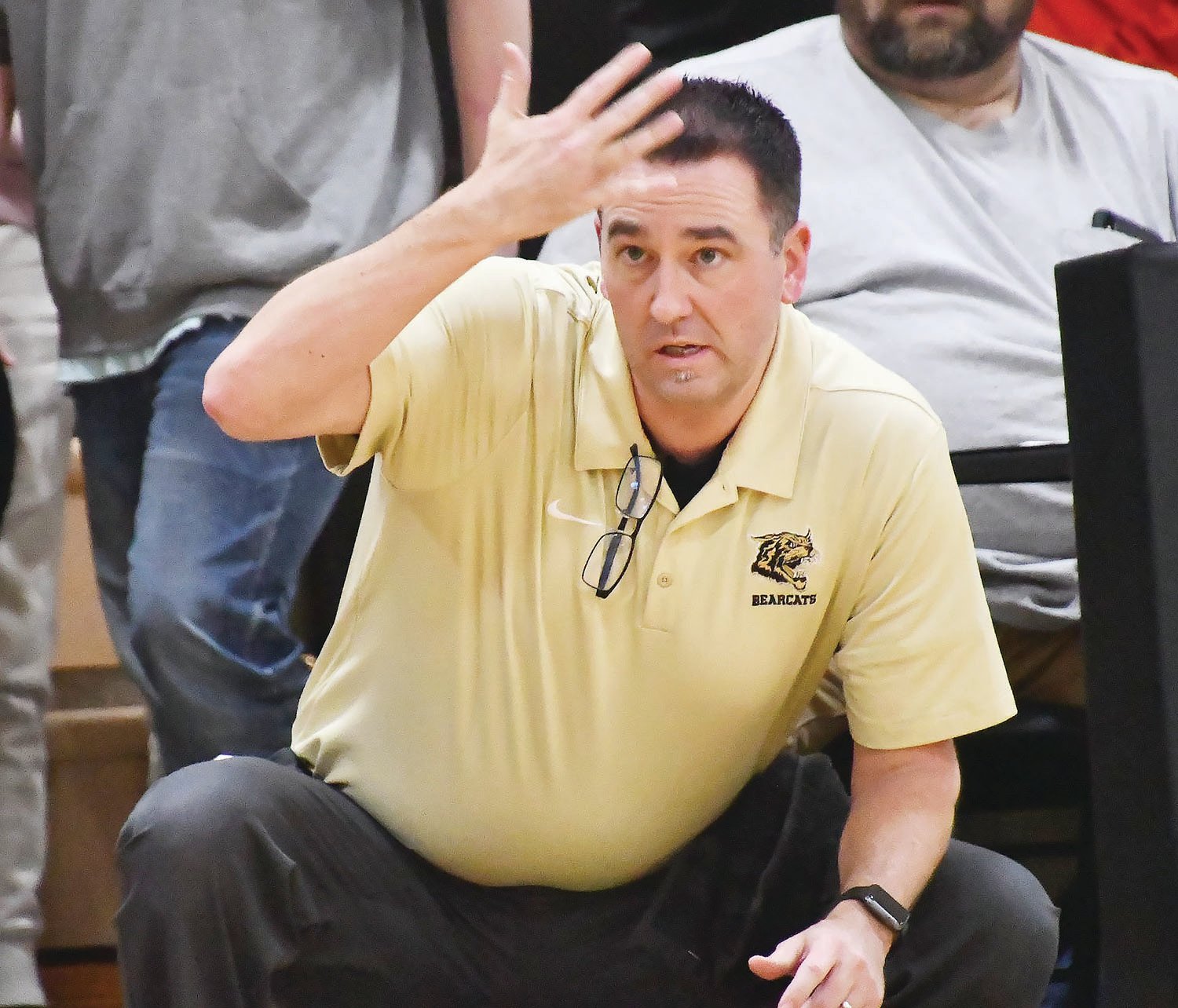 Cairo head boys basketball coach Nic Zenker motions from the sideline during Friday's Central Activities Conference game.