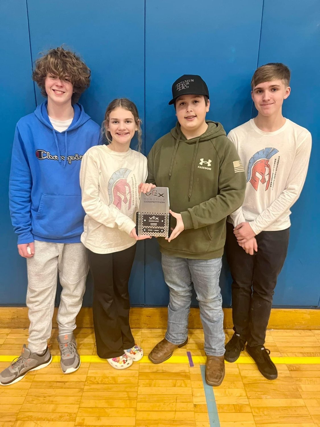 In this file photo, Moberly's Junior ROTC robotics team, Marshall Dixson, Zoe Mudd, Austin Kitchen and Gage Ferguson, hold an award they earned during a competition in January.