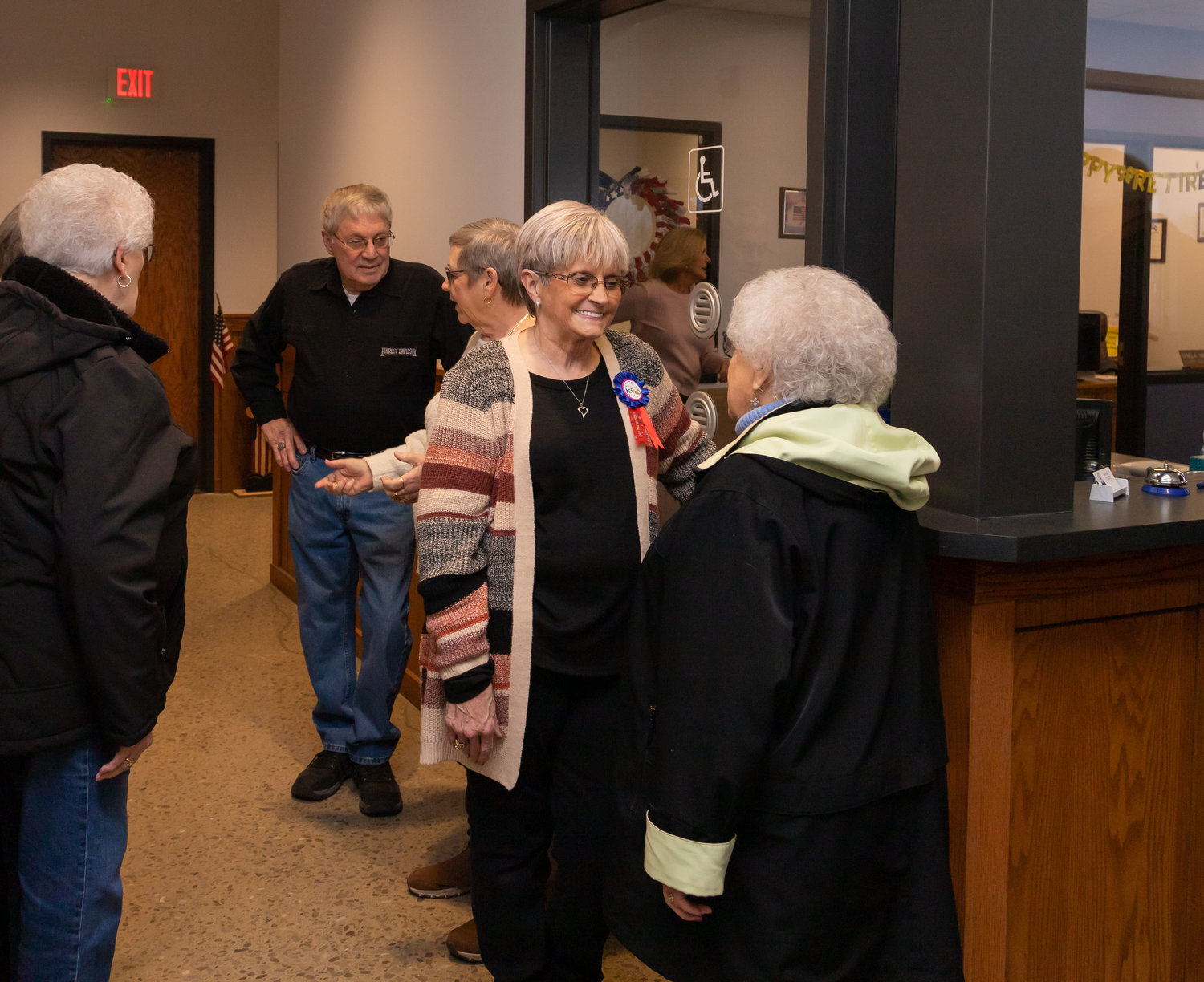 Randolph County Collector Shiela Miller, smiling at center, visits with friends and coworkers during a retirement party at Randolph County Courthouse in February. Miller retired after 24 years. Michelle Lee is the new county collector.