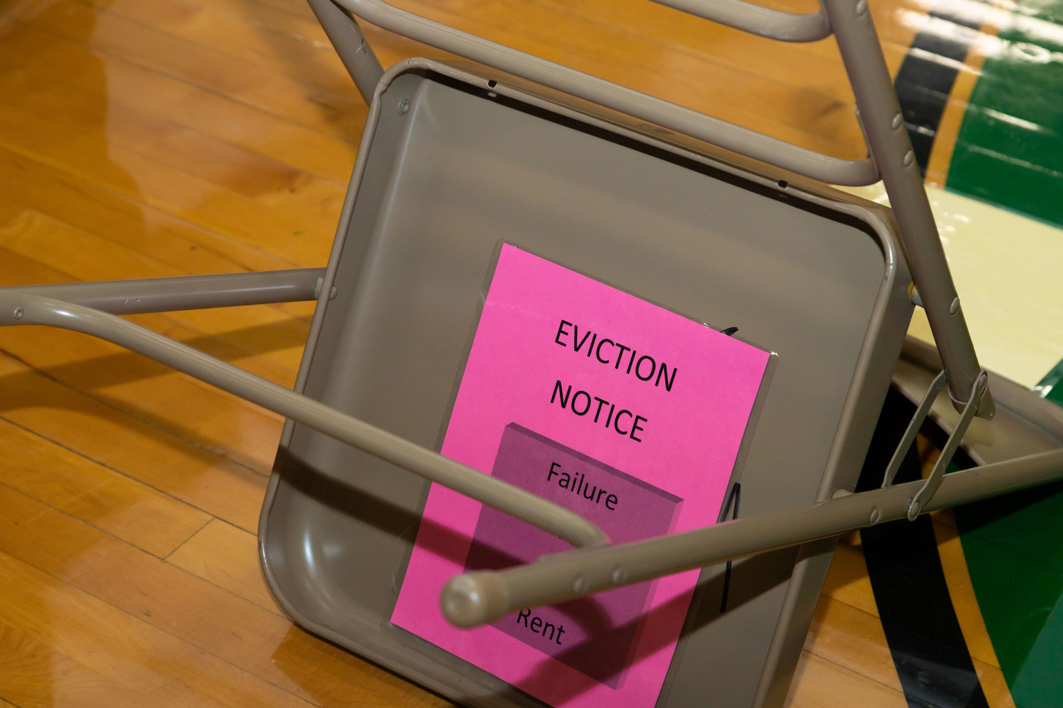 An overturned chair represents eviction in an exercise at Westran High School.