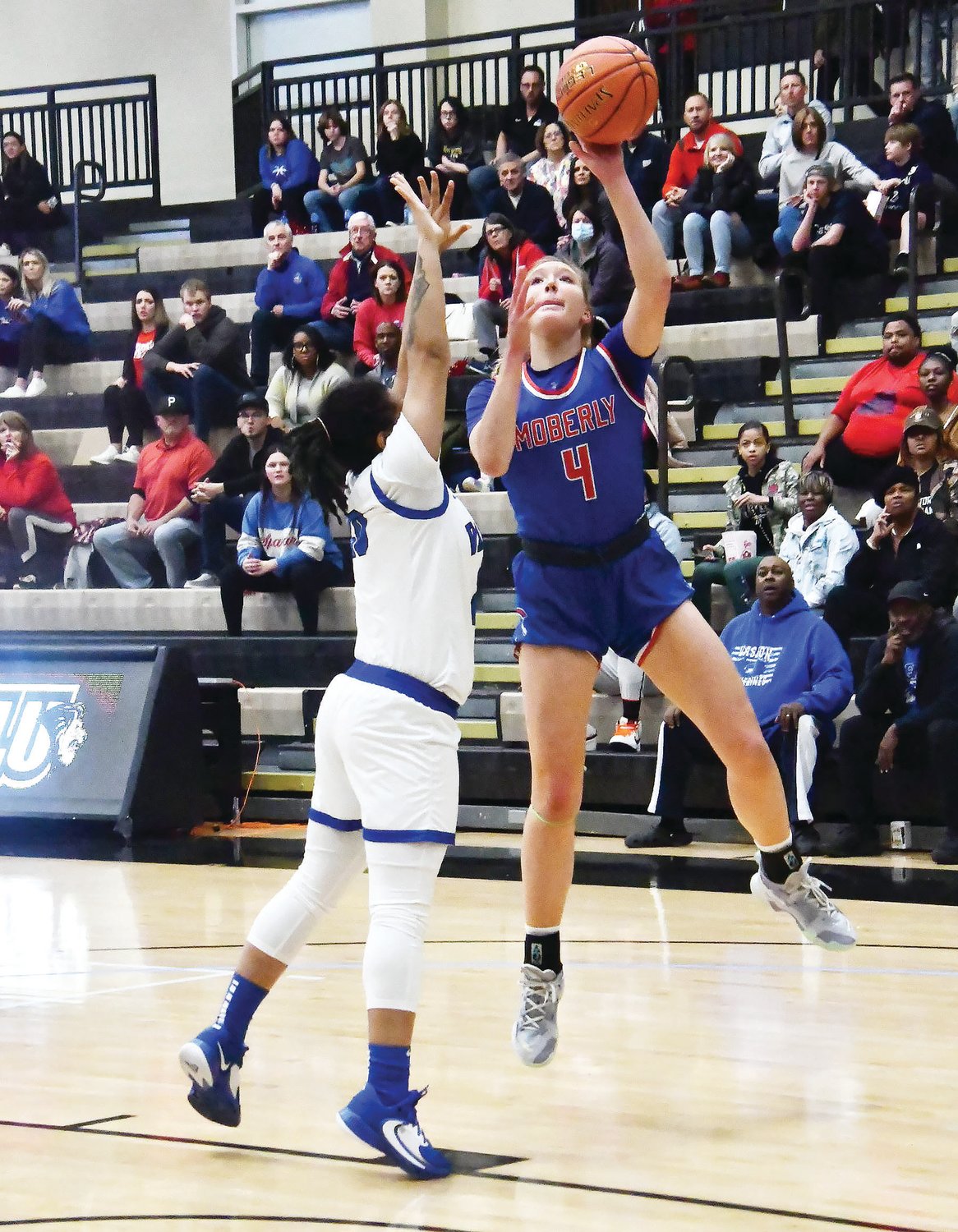 Moberly girls basketball player Asa Fanning (4) attempts a shot during Saturday's Class 4 state quarterfinal game at Lindenwood University's Hyland Arena.