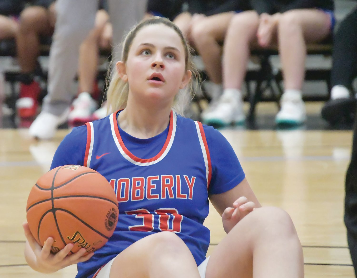Savanna Orscheln looks up at one of the officials after a jump ball is called.