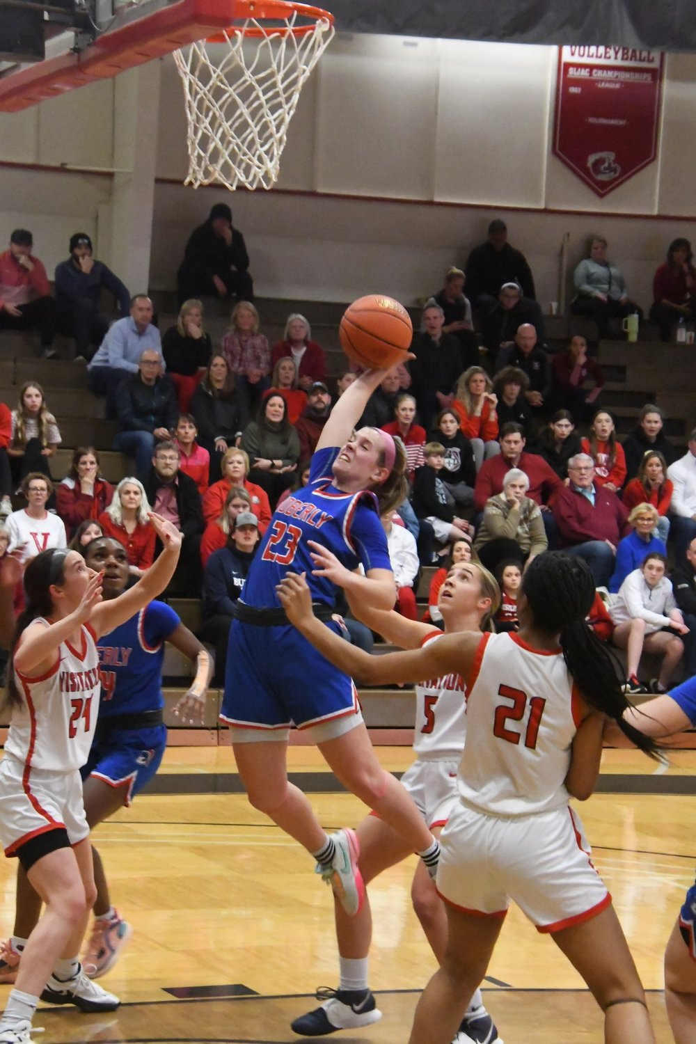 Moberly's Kennedy Messer emphatically grabs a rebound during the Spartans' 55-48 sectional victory over Visitation Academy at Maryville University's Moloney Gymnasium in Town & Country.