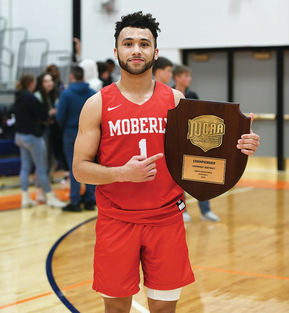 Xavier Sykes shows off the Midwest District Championship the Moberly Area Community College men's basketball won on Saturday, March 11 in Freeport, Ill. Sykes was a standout for Columbia Rock Bridge.