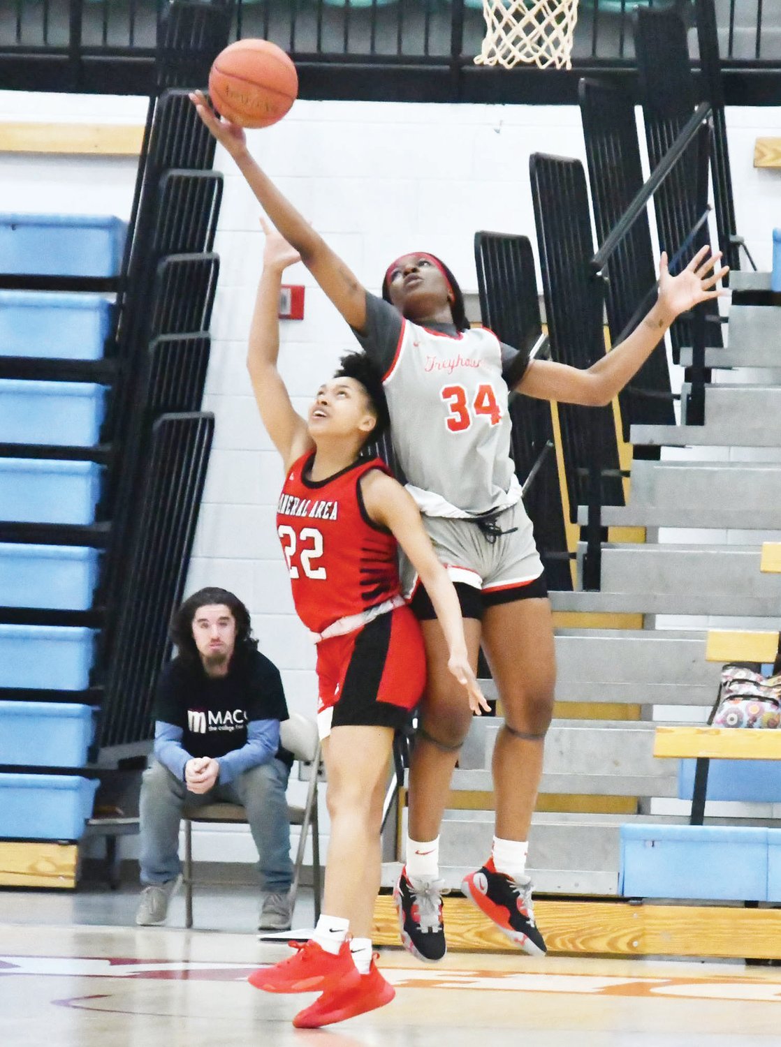 Moberly Area's Jenny Ntambwe grabs a rebound during the Region XVI women's basketball championship game. She corralled 11 rebounds, including four offensive.