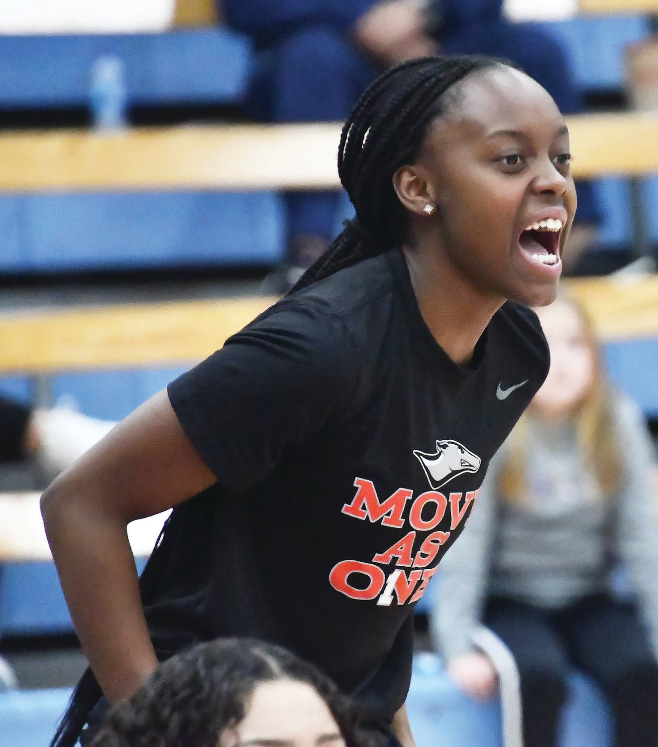 Kayhla Adams cheers on her teammates from the sideline during a Region XVI women's basketball championship game Friday, March 10.