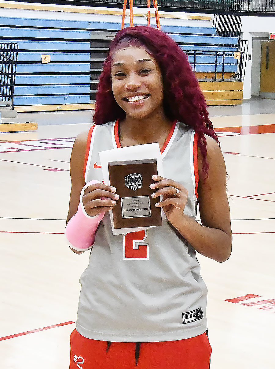 Moberly Area's Keiori Lee shows off her plaque for being named to the all-Region XVI first team.