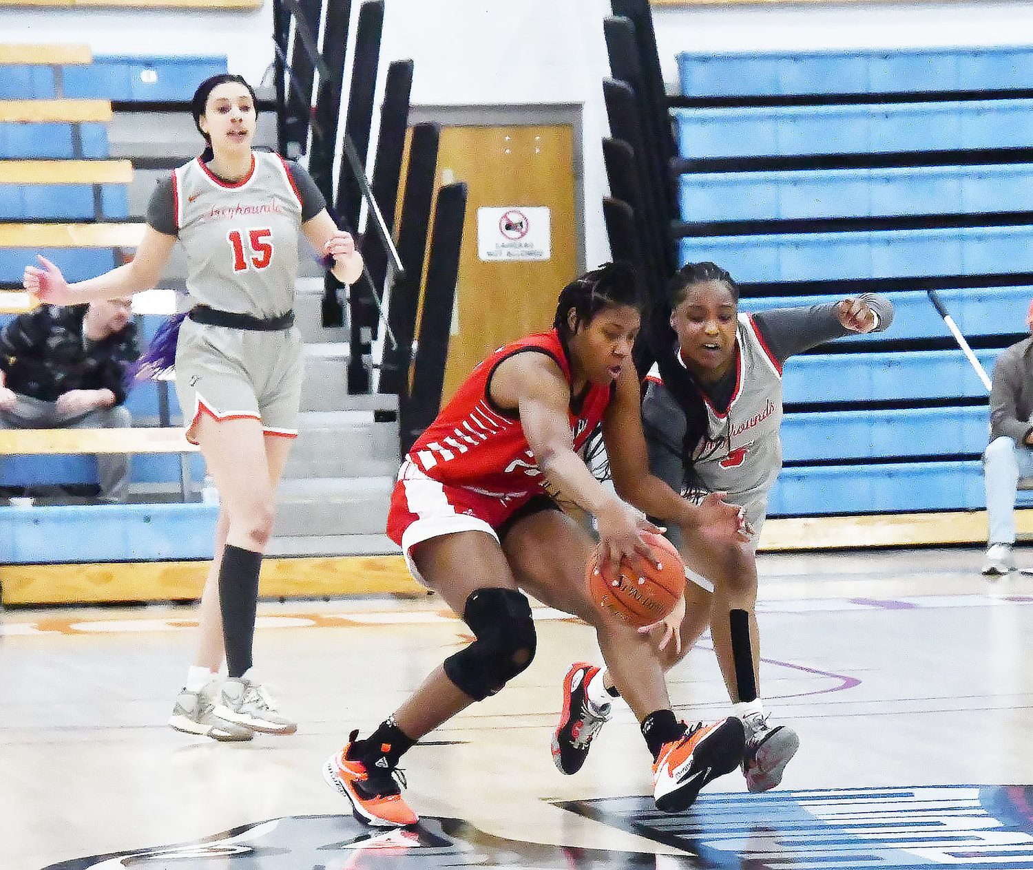 Moberly Bukky Akinsola (right) attempts to steal the ball during the first quarter of the Region XVI women's basketball championship game Friday, March 10, at Fitzsimmons-John Arena.