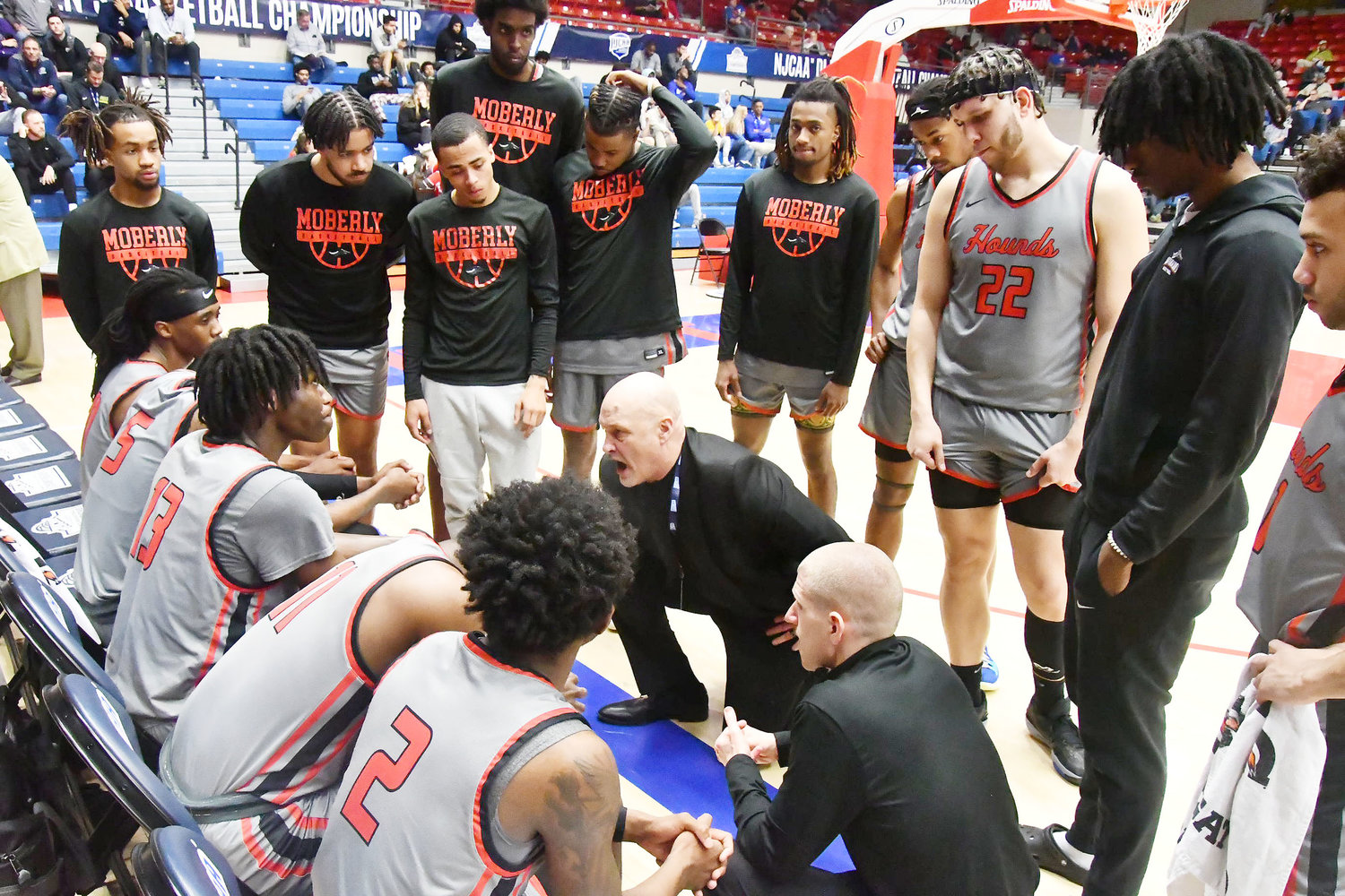 Moberly Area Community College head men's basketball coach Patrick Smith talks to the team during a timeout in the second half.
