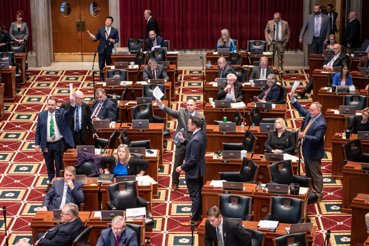 Missouri House Republicans raise their hands to speak on a ban for gender-affirming care for minors as House Majority Leader Jon Patterson, R-Lee's Summit, moves for a vote.